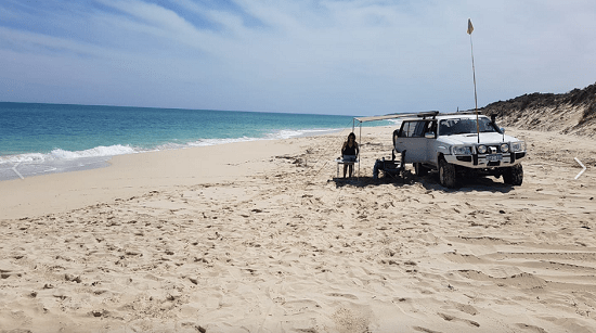 White coloured 4WD parked on a beach and as the header of "wilbinga conservation park" blog.