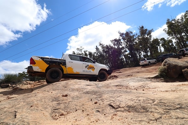 An official 4WD of Eureka 4WD parked on an off-road terrain.